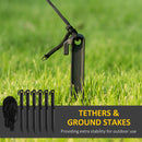 Ground stakes with tethers on grass with text 'Tethers & Ground Stakes' and 'Providing extra stability for outdoor use'.
