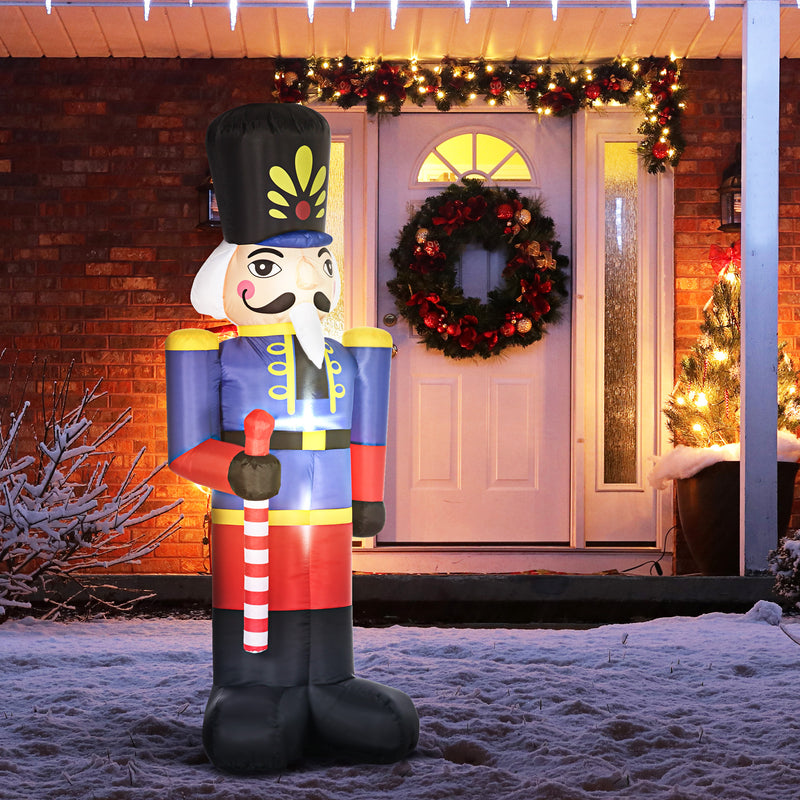Giant inflatable Christmas display nutcracker decoration in front of a house with Christmas decorations.
