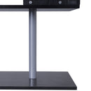 Close-up of a black table with a metallic leg on a white background