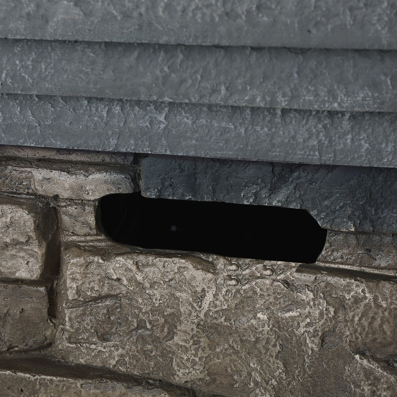 Close-up of a stone side wall of propane fire pit with a rectangular opening