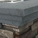 Close-up of stacked stone bricks with a focus on texture and color variation.