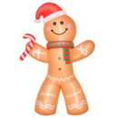 Inflatable gingerbread man with a Santa hat and candy cane on a white background