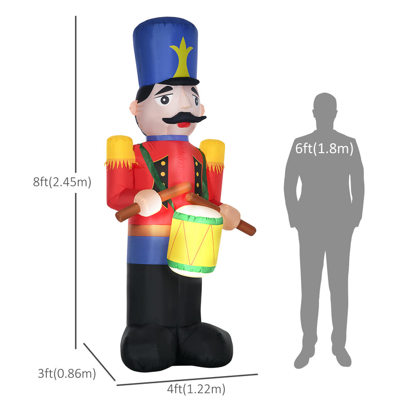 Inflatable Christmas display toy soldier with dimensions and a person for scale on a white background