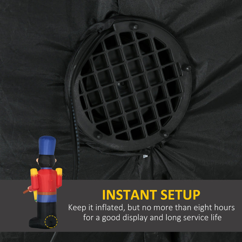 Black inflatable display with a nutcracker figure and text about setup instructions.