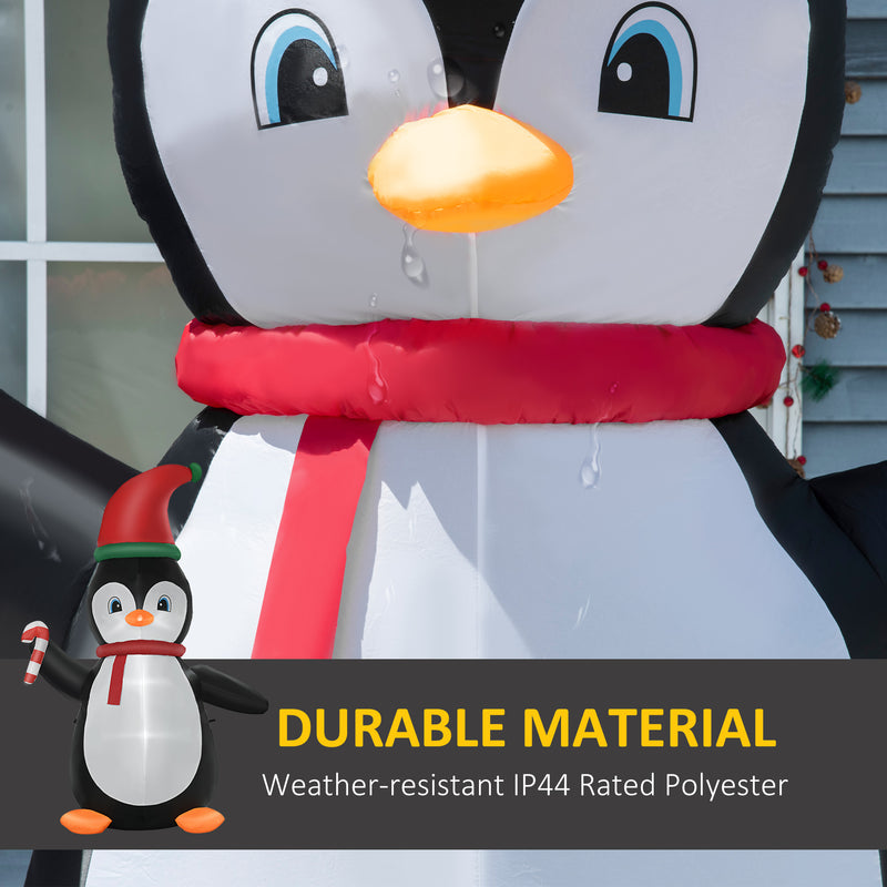 Inflatable penguin decoration Christmas display with built-in LED with a red scarf and small penguin graphic, text 'Durable Material' and 'Weather-resistant IP44 Rated Polyester'.