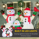 Inflatable snowman family with built-in LED lights in front of a house.