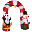 Inflatable Christmas arch with penguin and snowman decorations on a white background