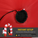 Red inflatable decoration with air blower and candy cane arch, featuring text about instant setup.