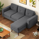 Gray sectional sofa in a living room setting with wooden coffee table and decorative elements.