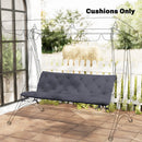 Gray cushioned swing chair with transparent canopy on a patio