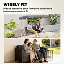 Family sitting on a swing and a wicker chair with a garden view.