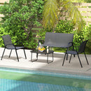Black outdoor patio set with chairs and a table by a pool