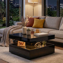 Modern living room with a square black coffee table, gray sofa, and decorative items.