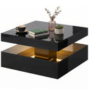 Black two-tiered square coffee table with decorative items on a white background