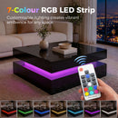Living room with a glossy black coffee table featuring an RGB LED strip and a remote control.