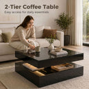 Woman sitting on a couch next to a black 2-tier square coffee table with storage compartments.