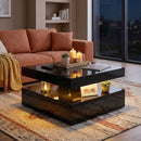 Modern living room with a black coffee table, candles, and a couch.
