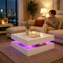 Woman sitting on a couch in a modern living room with a stylish coffee table.