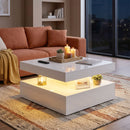 Modern living room with a white coffee table, candles, and a brown sofa.