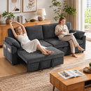A dark gray fabric sectional sofa in a bright, modern living room, with two women relaxing and reading on the couch. One woman is reclining with her arms stretched above her head, and the other is sitting upright holding a mug and a tablet.