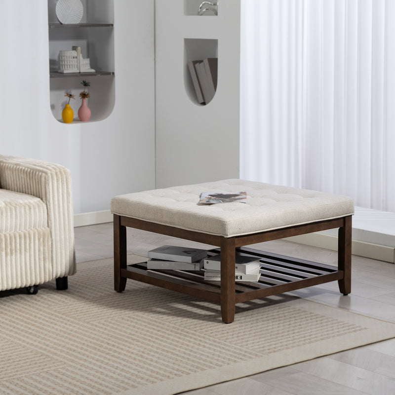 Beige ottoman with wooden frame in a living room setting