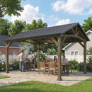 Wooden hard top gazebo with people enjoying a meal outdoors on a sunny day.