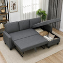 A gray fabric sectional sofa bed shown in a styled living room, with the right side folded down into a bed and the storage compartment open to reveal folded blankets and pillows.