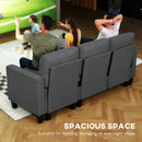 Gray sectional sofa in a living room with people sitting on it, text 'Spacious Space' displayed.