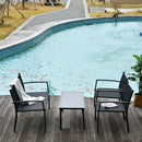 Outdoor furniture set by a pool with chairs and a table on a wooden deck.