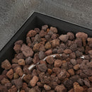 Decorative stones in a black stone fire pit with a propane fire ring 