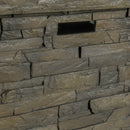 Close-up of a stone fire pit side wall with varying stone sizes and colors.