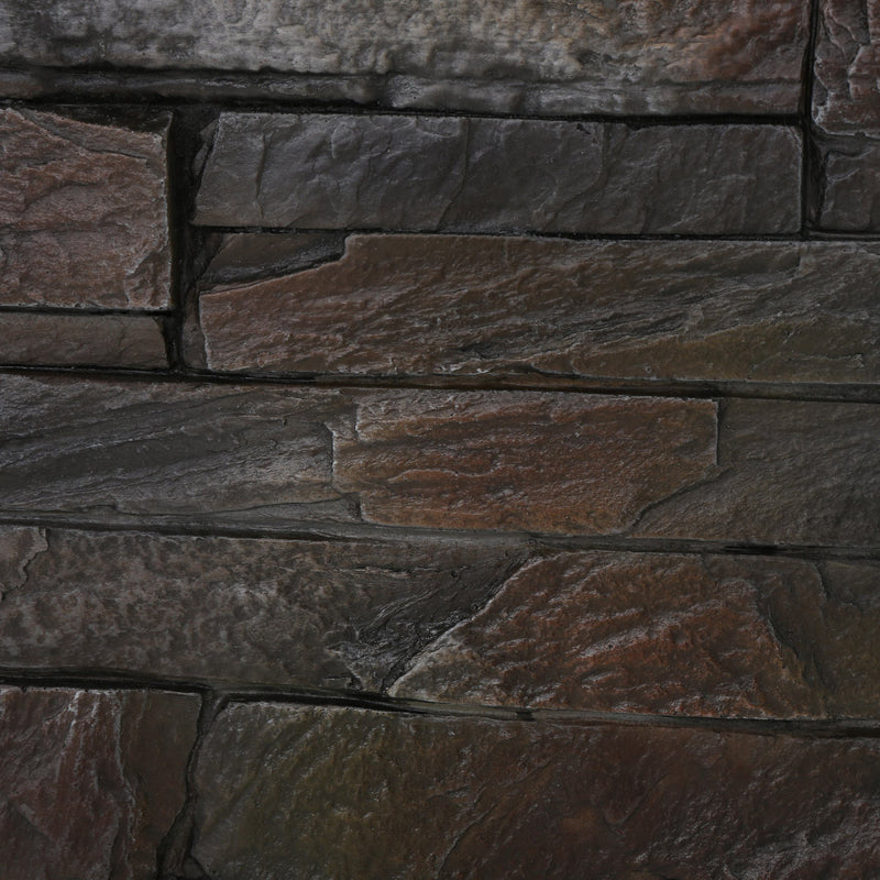 Close-up of a stone wall with brown and gray stones