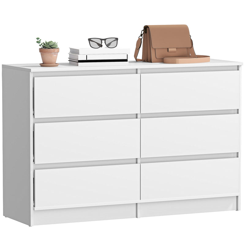 White dresser with six drawers and a small plant on top