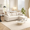 Beige sectional sofa in a living room with a coffee table and decor items.