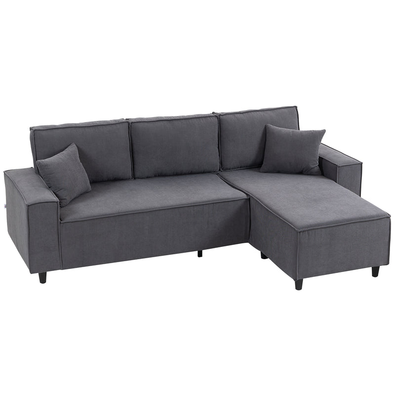 Gray sectional sofa with cushions on a white background
