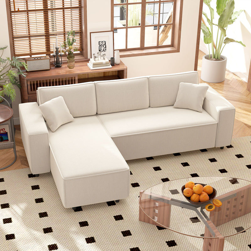 White sectional sofa in a living room with a glass coffee table and decorative items.