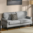 Gray traditional sofa with a patterned pillow in a living room setting
